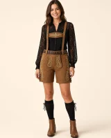 Woman wearing the Alpsee caramel lederhosen shorts with a black lace blouse, full-length front