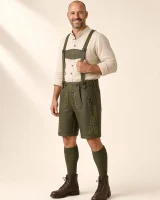 Three-quarter side view of the Fockenstein dark olive lederhosen on a man in his forties, thumb in the suspender